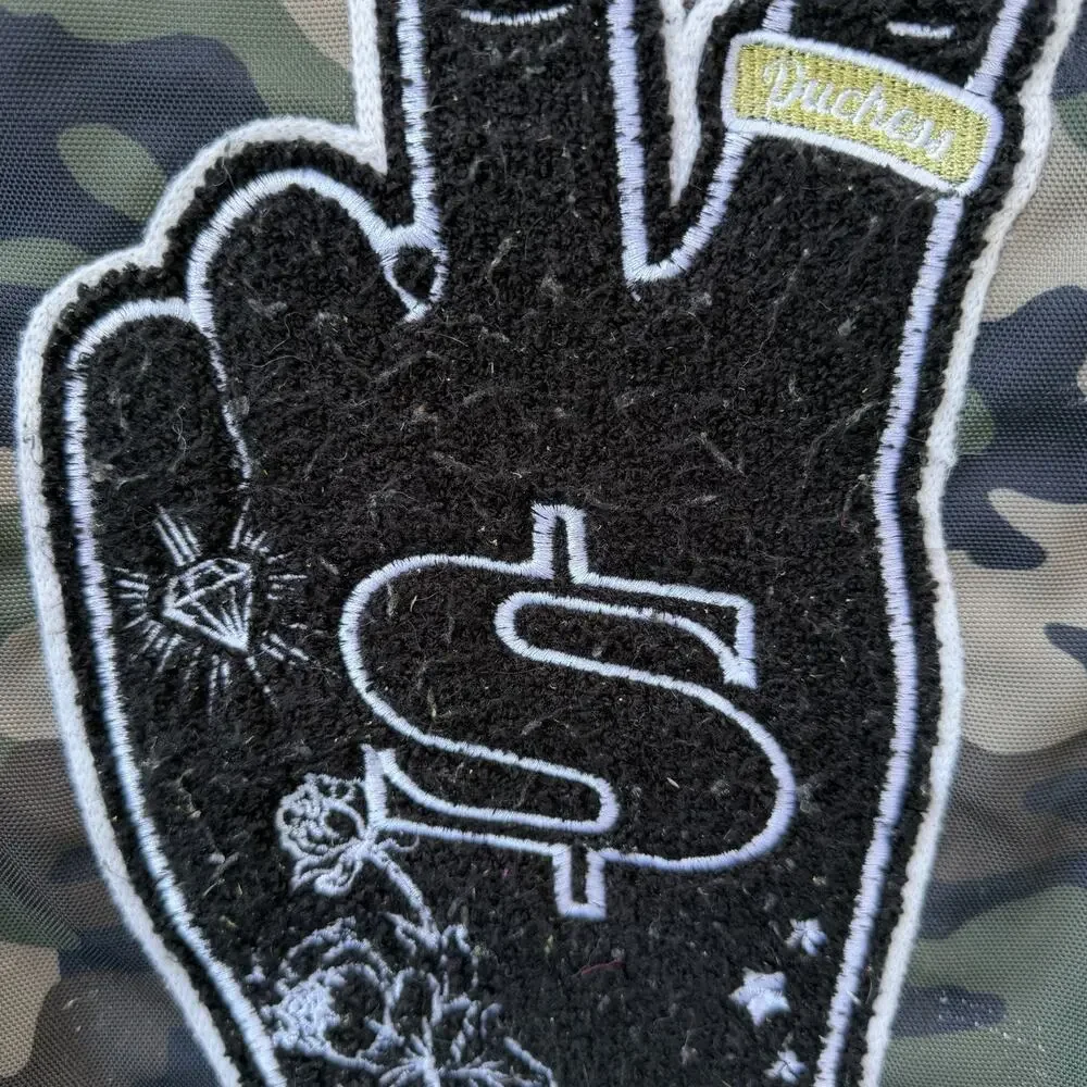 Sprayground Camouflage Backpack with Peace Sign Patch